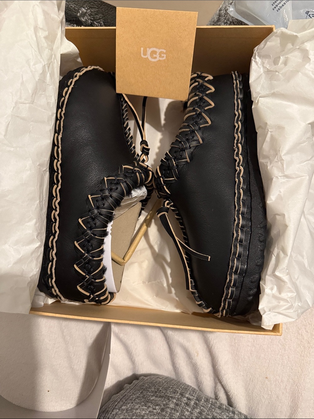 UGG Black Leather Moccasin Flats with Cream Whipstitch Trim